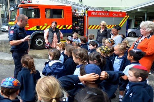 kids listening to firefighter